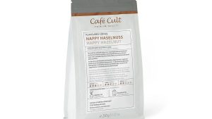 Kaffee Happy Haselnuss in 250g Tüte, ganze Bohne aromatisiert